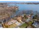 Stunning aerial view of lakeside homes, private docks, and mature trees, creating a serene waterfront community at 5153 Glenwood St, Sherrills Ford, NC 28673