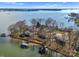 Breathtaking aerial view of a waterfront community with luxurious homes, private docks, and lush greenery on a peninsula at 5153 Glenwood St, Sherrills Ford, NC 28673