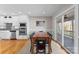 Bright dining room with a wooden table, chairs, and a sliding glass door to an outdoor deck at 5153 Glenwood St, Sherrills Ford, NC 28673