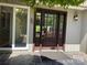 Elegant front door with glass accents, enhanced by stone tile and exterior lighting at 5153 Glenwood St, Sherrills Ford, NC 28673