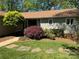 Charming home featuring mature landscaping, a well-manicured lawn, and inviting curb appeal at 5153 Glenwood St, Sherrills Ford, NC 28673