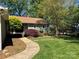 Landscaped front yard with a curved walkway leading to the entrance at 5153 Glenwood St, Sherrills Ford, NC 28673