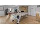 Game room featuring an air hockey table, pool table, and arcade games for entertainment at 5153 Glenwood St, Sherrills Ford, NC 28673