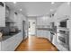Modern kitchen with stainless steel appliances, granite countertops, and white cabinetry at 5153 Glenwood St, Sherrills Ford, NC 28673