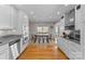 Eat in kitchen featuring stainless steel appliances, granite countertops, and hardwood floors at 5153 Glenwood St, Sherrills Ford, NC 28673