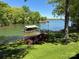 Beautiful lake view featuring a private boat dock and lush green surroundings at 5153 Glenwood St, Sherrills Ford, NC 28673
