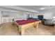 Recreation room with a pool table, air hockey table, bar, and comfortable seating area at 5153 Glenwood St, Sherrills Ford, NC 28673
