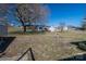 View of the expansive backyard with a storage shed, a large tree, and a birdbath at 605 Castlewood Dr, Gastonia, NC 28056