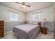 Bedroom with neutral walls, ceiling fan, and ample natural light at 605 Castlewood Dr, Gastonia, NC 28056