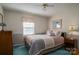 A cozy bedroom featuring a comfortable bed, a dresser, and soothing colors at 605 Castlewood Dr, Gastonia, NC 28056