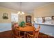 Dining area with wood floors, traditional furnishings, and adjacent to the kitchen at 605 Castlewood Dr, Gastonia, NC 28056