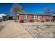 Ranch home with brick veneer, dark shutters, and a carport to the left of the home at 605 Castlewood Dr, Gastonia, NC 28056