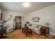 Inviting living room with traditional decor, floral sofa, wood laminate flooring, and ample light at 605 Castlewood Dr, Gastonia, NC 28056