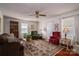 Cozy living room features a ceiling fan, rug, and an abundance of comfortable seating at 605 Castlewood Dr, Gastonia, NC 28056