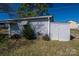 A storage shed is located in the backyard, providing space for gardening equipment at 605 Castlewood Dr, Gastonia, NC 28056