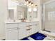 Double sink bathroom featuring tile floors and a shower at 8419 Belstead Brook Ct, Charlotte, NC 28216