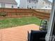 Backyard deck with wooden fence, garden bed, and partial view of seating area at 908 Morien St, Richburg, SC 29729