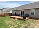 Cozy backyard with a wooden deck, outdoor seating, and a fire pit, perfect for entertaining at 908 Morien St, Richburg, SC 29729