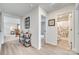 Hallway features wood-look floors, an industrial-style console table, and access to the bathroom and living areas at 908 Morien St, Richburg, SC 29729