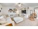 Bright living room featuring a large sectional sofa, vaulted ceiling, shelving, and a decorative ladder at 908 Morien St, Richburg, SC 29729