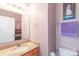 Bathroom features a light wood vanity with granite countertop, and decorative mirror with vanity lighting at 915 Tj Dr, Monroe, NC 28112