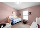 Bedroom featuring light pink walls and a twin daybed with light-colored carpet at 915 Tj Dr, Monroe, NC 28112