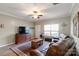 Comfortable living room showcasing leather sofas, a TV, and a large area rug at 915 Tj Dr, Monroe, NC 28112