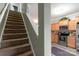 Interior view of a carpeted staircase next to an eat-in kitchen area at 915 Tj Dr, Monroe, NC 28112