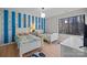 bedroom with two beds, playful decor, and a large window at 9334 Hunting Ct, Matthews, NC 28105