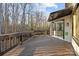 Wood deck overlooking wooded area, with sliding glass doors providing easy access to the home's interior at 9334 Hunting Ct, Matthews, NC 28105