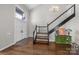 Grand foyer with hardwood floors, a staircase, and a stylish chandelier, welcoming guests with elegance at 9334 Hunting Ct, Matthews, NC 28105