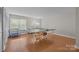 Finished game room with ping pong table and access to natural light at 9334 Hunting Ct, Matthews, NC 28105