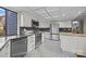Modern kitchen features stainless steel appliances, granite countertops, and stylish black and white patterned flooring at 9334 Hunting Ct, Matthews, NC 28105