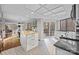 Open kitchen with granite countertops, stainless steel appliances, white cabinets, and access to a deck at 9334 Hunting Ct, Matthews, NC 28105
