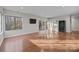 Open-concept living room with sliding glass doors to back patio at 9334 Hunting Ct, Matthews, NC 28105