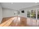 Bright living room with lots of natural light and sliding glass doors to back patio at 9334 Hunting Ct, Matthews, NC 28105