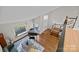 Bright living room with piano, fireplace, and staircase leading to the second floor at 9334 Hunting Ct, Matthews, NC 28105