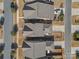 Birds eye view of the rooftops, landscaping and driveways of multiple homes in a suburban neighborhood at 9611 Rayneridge Dr, Huntersville, NC 28078