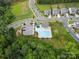 Areal photo featuring a community pool, clubhouse, playground, parking lot, and landscaped areas at 9611 Rayneridge Dr, Huntersville, NC 28078