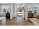 Open entryway featuring hardwood floors, decorative trim, and views of the neighborhood at 9611 Rayneridge Dr, Huntersville, NC 28078