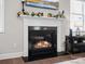 Living room fireplace with mantle, decorations and mounted television at 9611 Rayneridge Dr, Huntersville, NC 28078