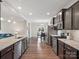 Modern kitchen showcasing stainless steel appliances and a view to the dining area at 9611 Rayneridge Dr, Huntersville, NC 28078