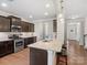 Kitchen with stainless steel oven and granite countertops, bar seating area at 9611 Rayneridge Dr, Huntersville, NC 28078