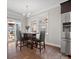 Eat-in kitchen with stainless fridge, wood floors and access to the outside patio and fenced yard at 9611 Rayneridge Dr, Huntersville, NC 28078