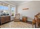 Cozy living room with natural light, an accent rug, and comfortable seating for relaxation at 9611 Rayneridge Dr, Huntersville, NC 28078