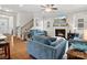 Comfortable living room featuring a fireplace and staircase to the second floor at 9611 Rayneridge Dr, Huntersville, NC 28078