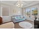 Comfortable living room with abundant natural light, hardwood floors, and stylish decor at 9611 Rayneridge Dr, Huntersville, NC 28078