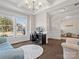 Open-concept living room showcasing ample light, hardwood floors, and a seamless flow throughout at 9611 Rayneridge Dr, Huntersville, NC 28078
