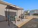 Back patio featuring an outdoor dining set and grill; ideal for outdoor entertaining at 9611 Rayneridge Dr, Huntersville, NC 28078