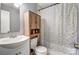 Bathroom showcasing a sink and vanity plus a shower-tub with a shower curtain at 1001 E 8Th Ave, Gastonia, NC 28054